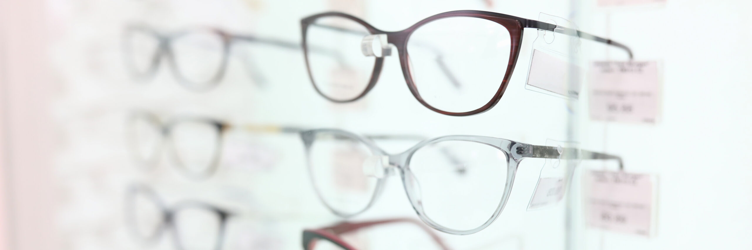 On stand are glasses in beautiful frames. closeup On stand are glasses in beautiful frames. Optics salon concert